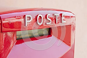 Old italian public red metal mailbox with italian Poste text photo