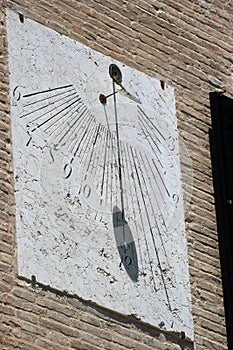 Old italian sundial in stone support