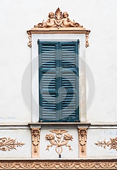 Old italian window with fresco