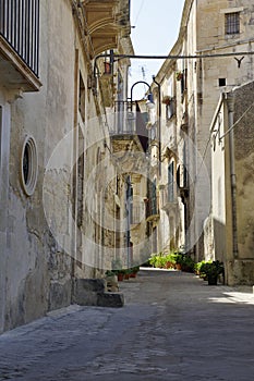 Old Italy, narrow street in old city of Modica.