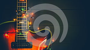 Old, jazz electric guitar with a luminous garland. New Year greeting card for musician, guitarist.