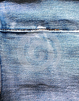 Old jeans. Frayed denim stitches. Shabby material