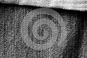 Old jeans texture close-up, top view. Monochrome denim background