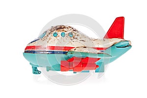 Old Jet plane tin toy isolated on white