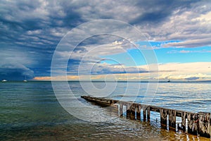 Old jetty dark clouds and ocean before the summer stormbefore the storm