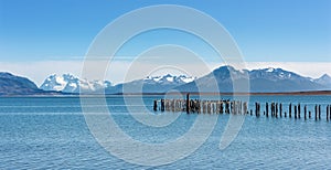 Old jetty with king cormorants at Ultima Esperanza Fjord near Puerto Natales, Patagonia, Chile photo