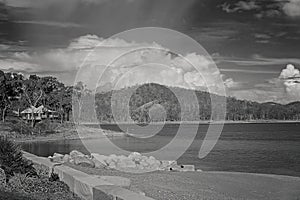 Old Jetty Rocks And Shade Structures At Popular Lake