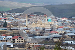 Old Juma mosque in the cityscape, January day. Shamakhi, Azerbaijan