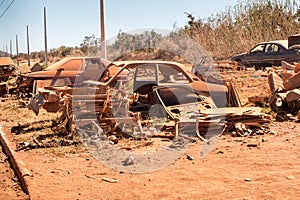 Old Junk Cars left on the side of the Road to deteriorate photo