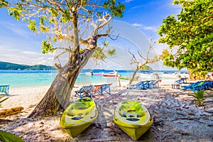 Old kayaks and beach chairs