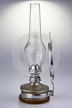 Old kerosene lamp isolated on white background