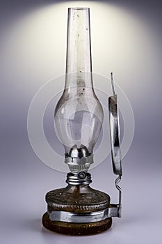 Old kerosene lamp isolated on white background