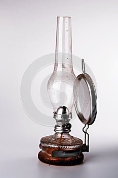 Old kerosene lamp isolated on white background