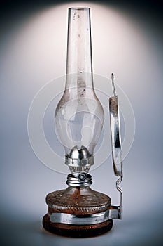 Old kerosene lamp isolated on white background