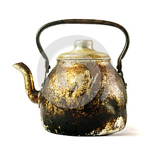 An old kettle with fire burns and dirt