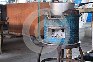 Old kettles on charcoal grills that have been used for a long time in the kitchen Boiling using hot water
