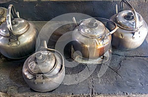 Old kettles on a traditional wood stove in Yogyakarta, Indonesia