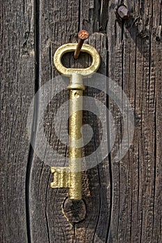Old key of gold colour.