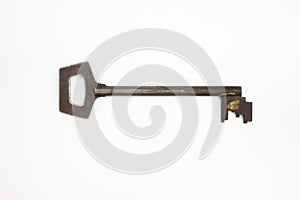 Old key isolated. Keys on table. Ancient keys, used for long time. Vintage key on white background