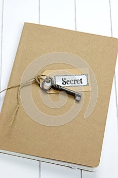 Old key and label tag on notebook