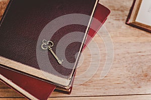 Old key on pile of old books