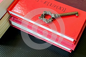 Old key on red books