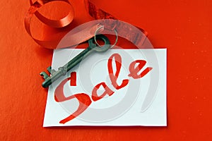 Old key with a red ribbon