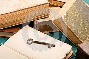 Old key, stack of antique books