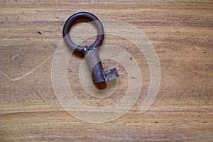 Old key on wooden table