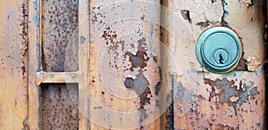 Old keyhole on rusty stainless steel door with copy space