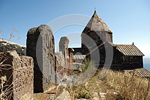 Old Khachkar (cross) in The Island Monastery or Sevanavank (church) in Sevan Island, Armenia