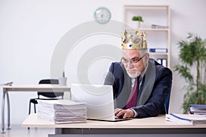 Old king businessman employee at workplace