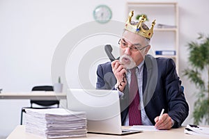 Old king businessman employee at workplace