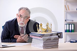 Old king businessman employee at workplace