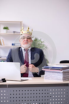 Old king businessman employee at workplace