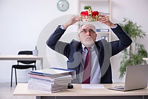 Old king businessman employee at workplace