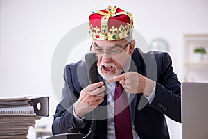 Old king businessman employee at workplace