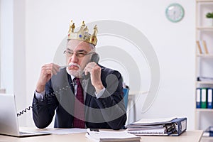 Old king businessman employee at workplace