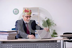 Old king businessman employee at workplace