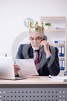 Old king businessman employee at workplace