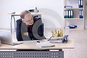 Old king businessman employee at workplace