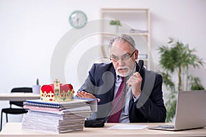 Old king businessman employee at workplace