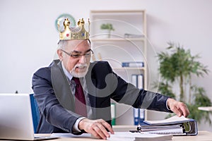 Old king businessman employee at workplace