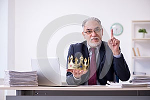 Old king businessman employee at workplace