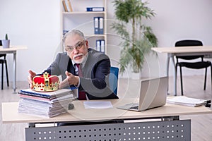 Old king businessman employee at workplace