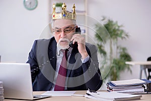 Old king businessman employee at workplace