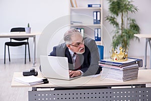 Old king businessman employee at workplace