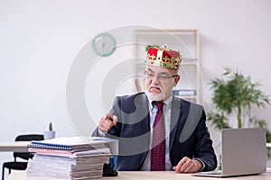 Old king businessman employee at workplace