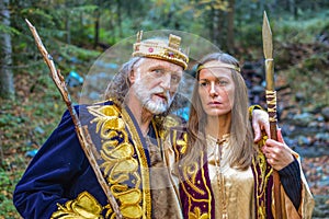 Old king and queen in the forest