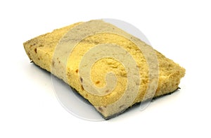 Old kitchen sponge on white background.